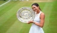 Wimbledon champion Muguruza has a 'love-hate relationship' with tennis