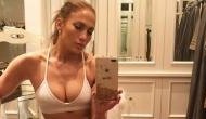 Jennifer Lopez flaunts her perfect abs in sexy black bikini at the beach for her 49th birthday