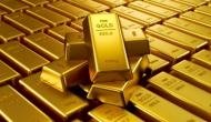 Gold futures up on spot demand, trade war fears