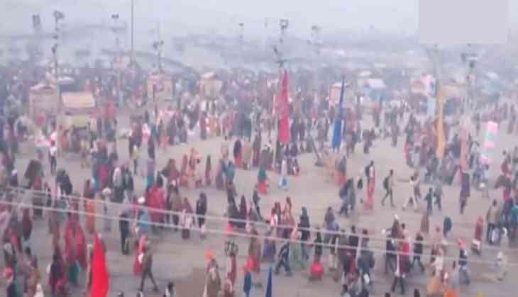 Devotees take a holy dip at Sangam on the occasion of Magh Purnima