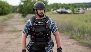 Ukraine: Safety adviser for news agency killed in Russian strike on hotel, 2 injured
