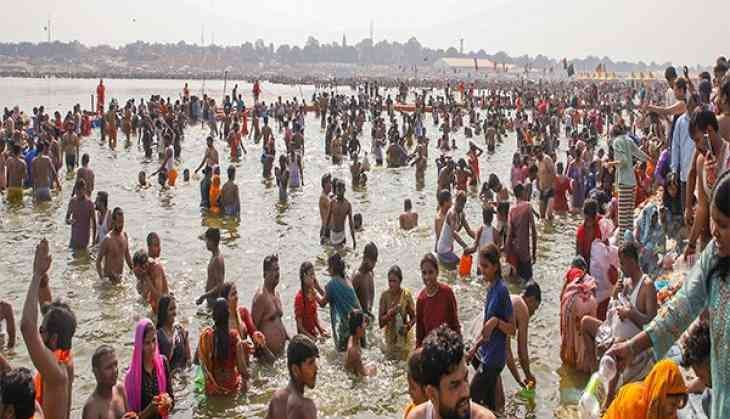 Devotees take a dip at Triveni Sangam during the ongoing 'Mahakumbh Mela 2025